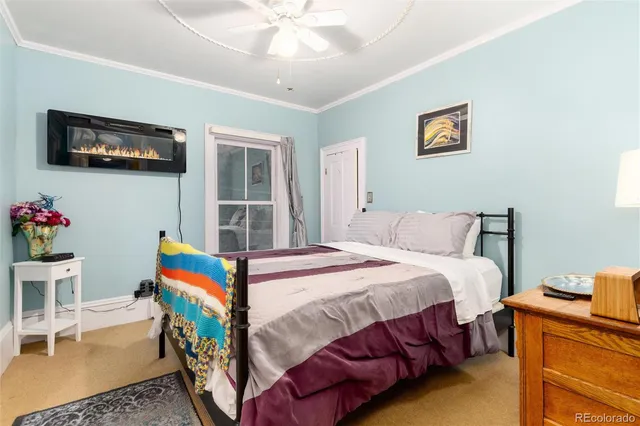 a bed room with a bed and a chandelier