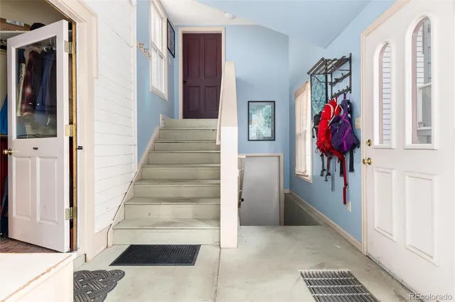 a view of a hallway with paintings on the walls