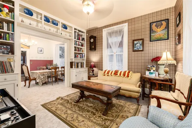 a living room with furniture and a rug
