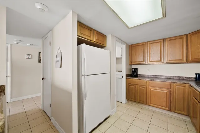 a kitchen with stainless steel appliances granite countertop a sink dishwasher cabinets and granite countertops with wooden floor