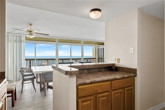 a utility room with cabinets washer and dryer