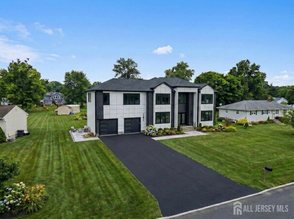 11 Williams Road Kendall Park, NJ 08824 - Photo 2 of 60 a front view of a house with a yard