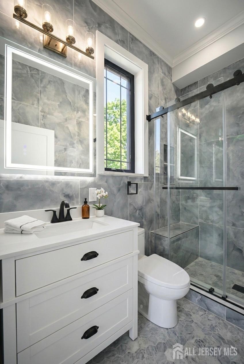 11 Williams Road Kendall Park, NJ 08824 - Photo 26 of 60 a bathroom with a sink a toilet and shower