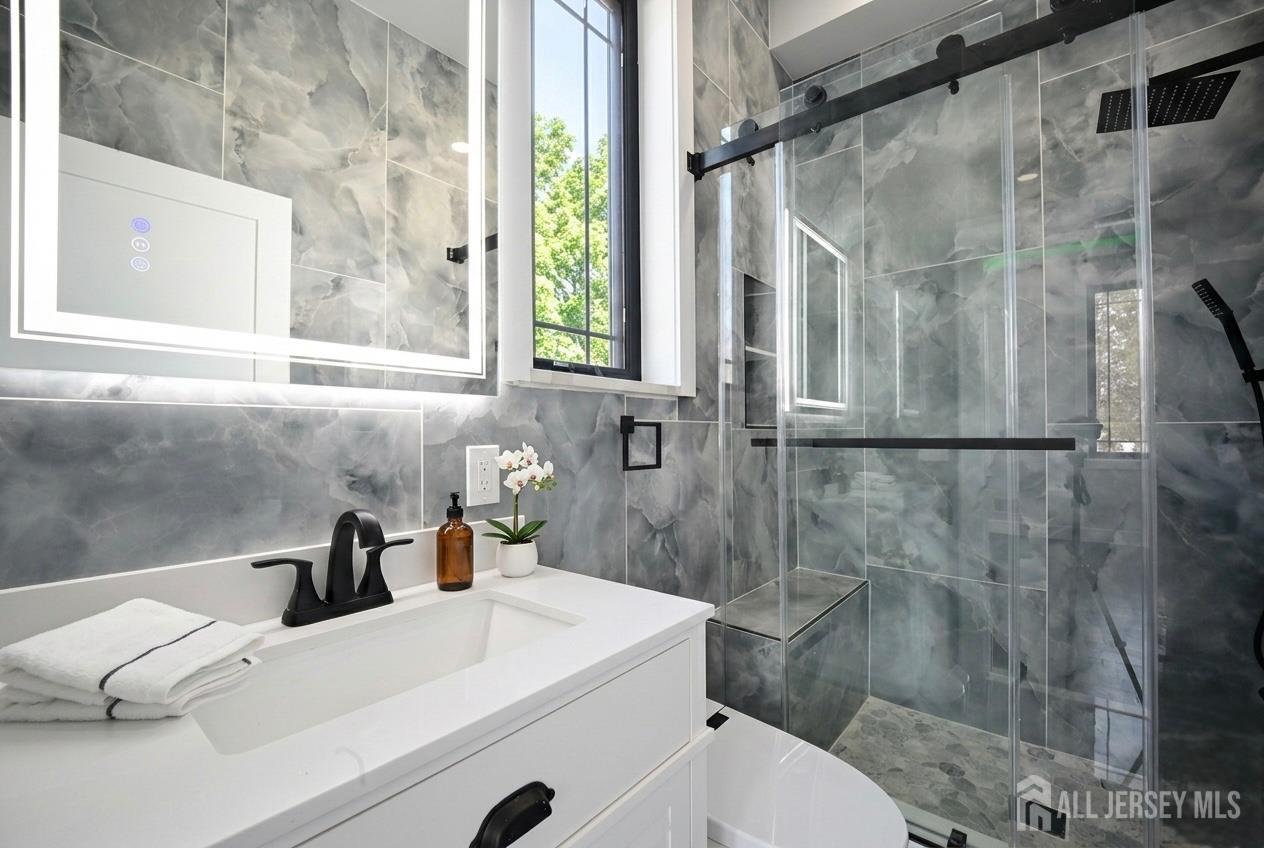 11 Williams Road Kendall Park, NJ 08824 - Photo 27 of 60 a bathroom with a sink toilet and shower