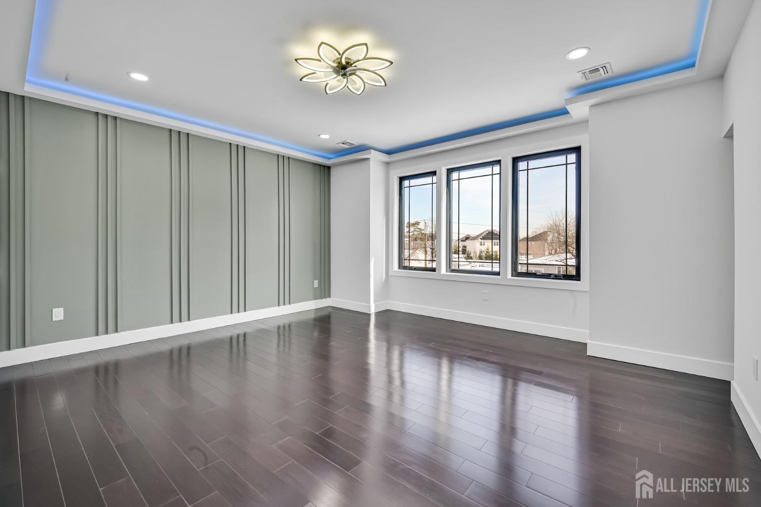 11 Williams Road Kendall Park, NJ 08824 - Photo 29 of 60 a view of an empty room with a window and wooden floor