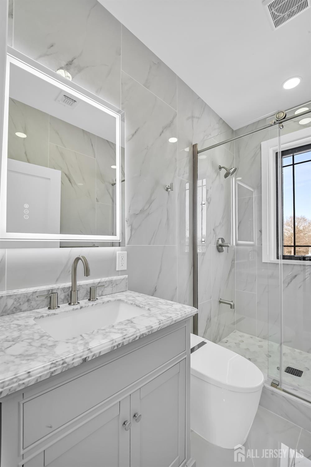 11 Williams Road Kendall Park, NJ 08824 - Photo 30 of 60 a bathroom with a granite countertop sink a toilet and shower