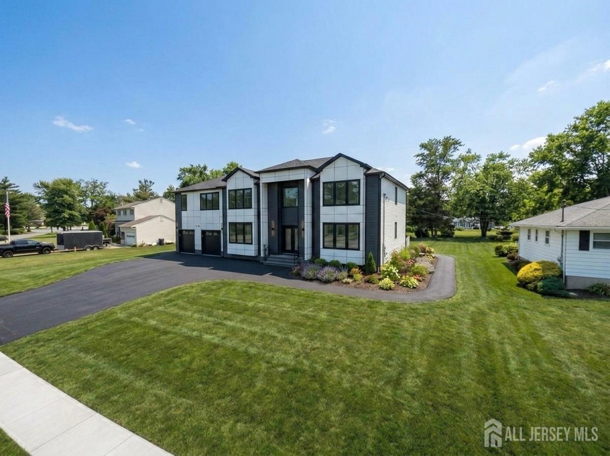 11 Williams Road Kendall Park, NJ 08824 - Photo 3 of 60 a view of a house with a yard and sitting area