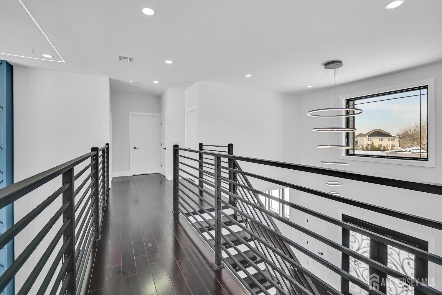 11 Williams Road Kendall Park, NJ 08824 - Photo 34 of 60 a view of hallway with couches and wooden floor