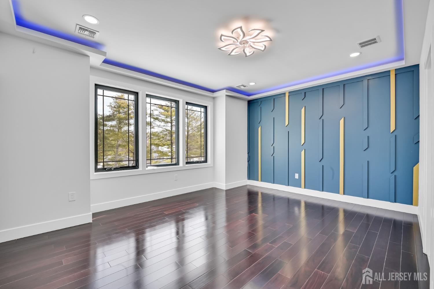 11 Williams Road Kendall Park, NJ 08824 - Photo 37 of 60 a view of an empty room with a window and wooden floor