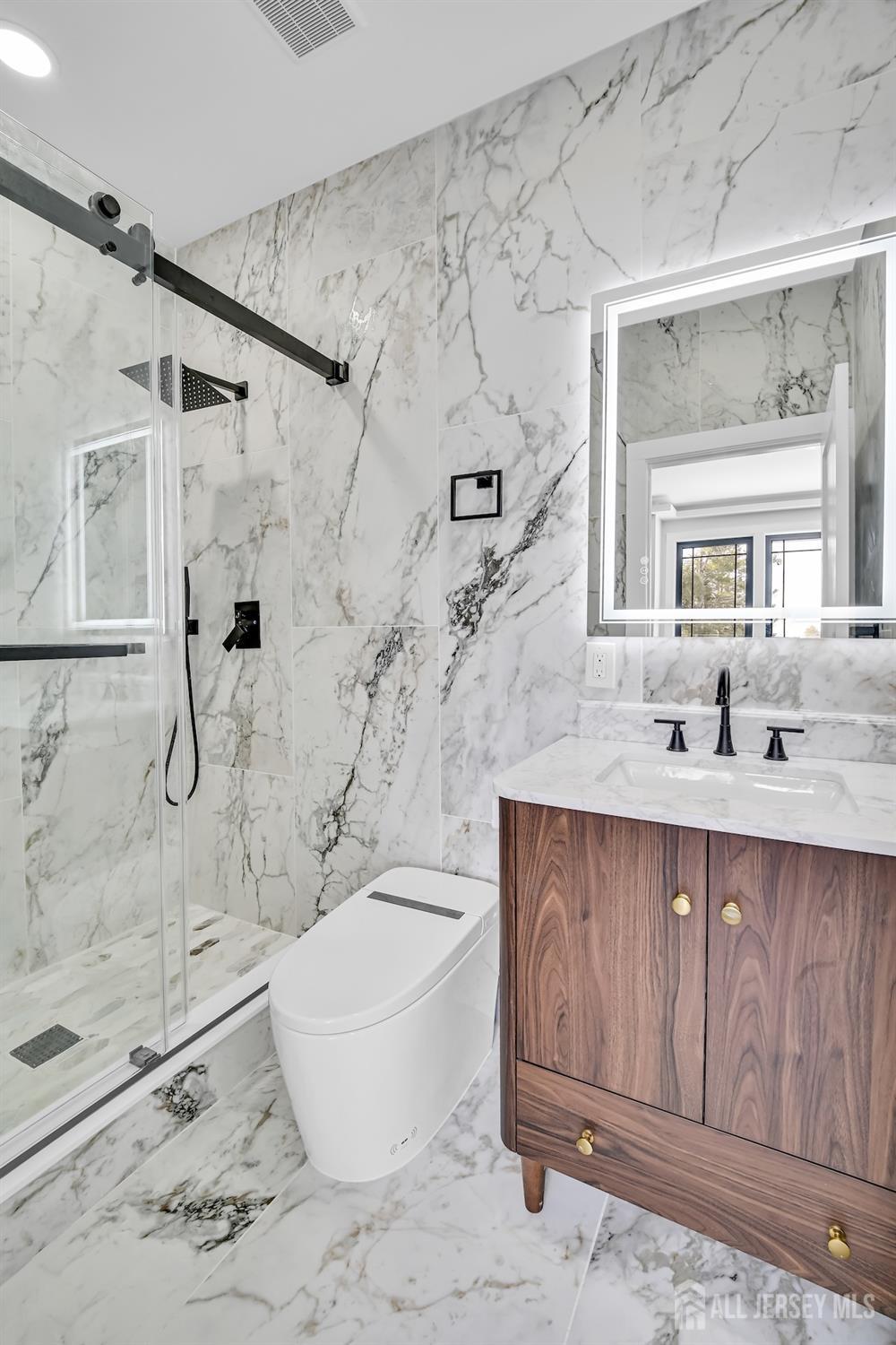 11 Williams Road Kendall Park, NJ 08824 - Photo 38 of 60 a bathroom with a granite countertop sink toilet a mirror and shower