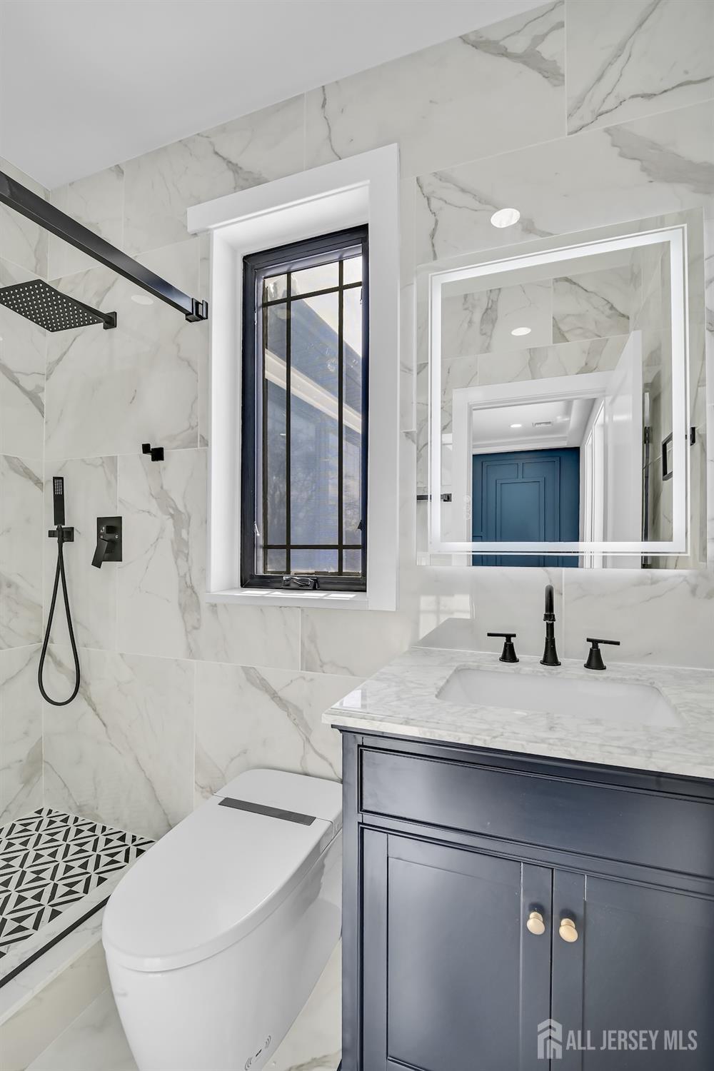 11 Williams Road Kendall Park, NJ 08824 - Photo 41 of 60 a bathroom with a sink and a mirror