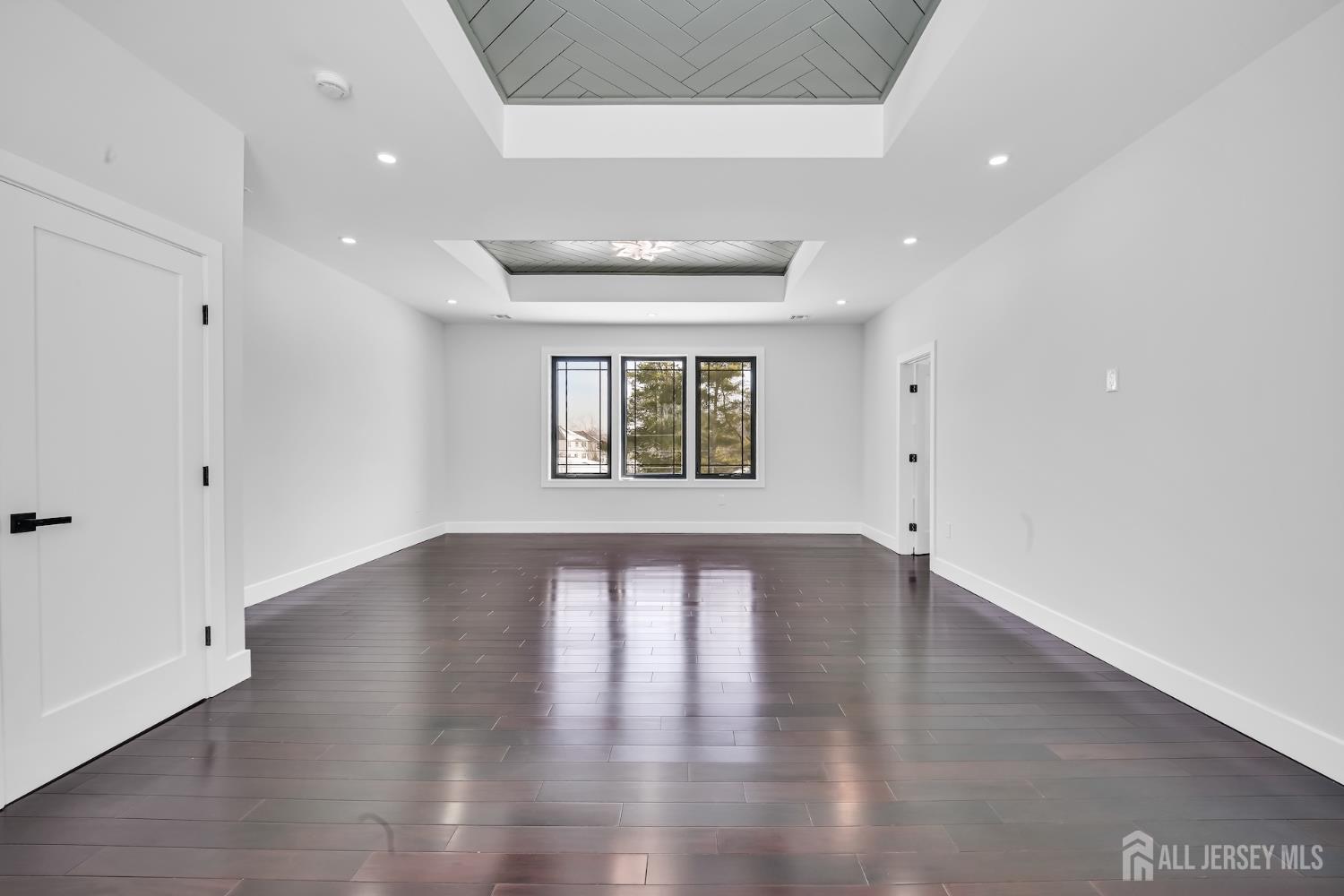 11 Williams Road Kendall Park, NJ 08824 - Photo 42 of 60 wooden floor in an empty room with a window
