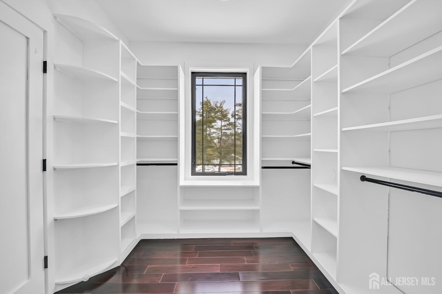 11 Williams Road Kendall Park, NJ 08824 - Photo 47 of 60 a view of an empty room with a window and wooden floor