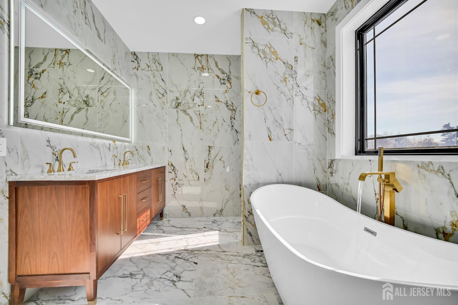 11 Williams Road Kendall Park, NJ 08824 - Photo 48 of 60 a bathroom with a bathtub and shower