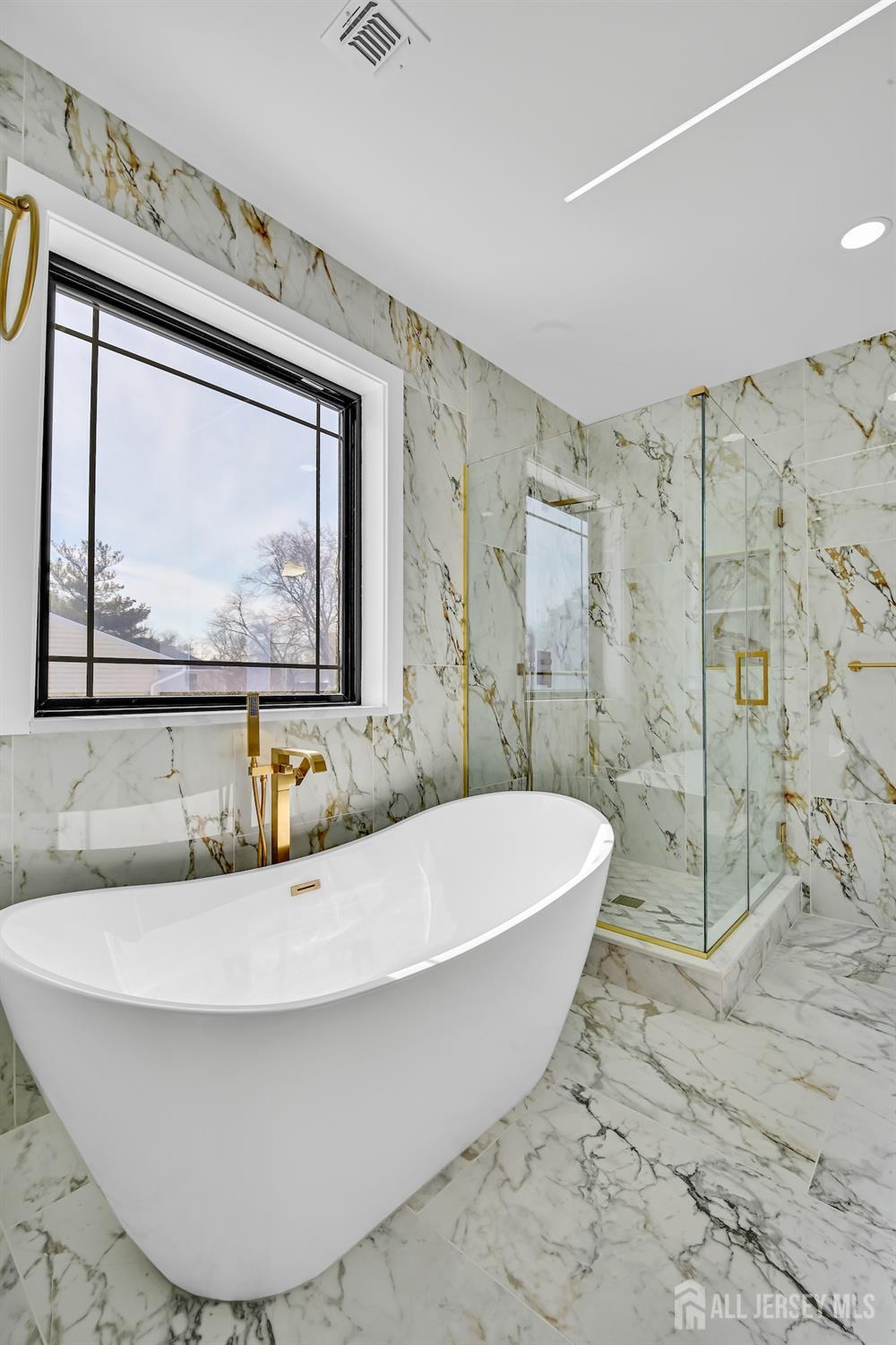 11 Williams Road Kendall Park, NJ 08824 - Photo 49 of 60 a white bath tub sitting in a bathroom