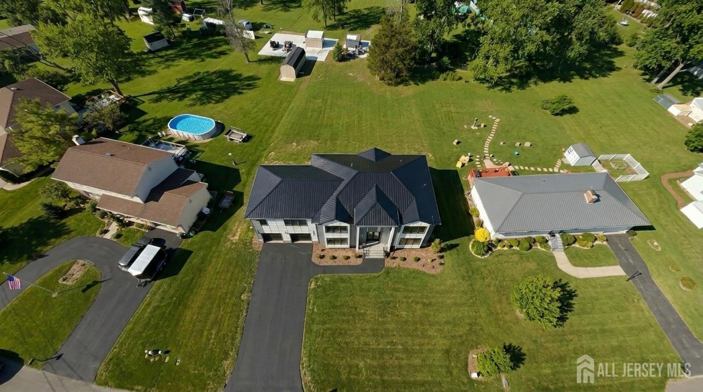 11 Williams Road Kendall Park, NJ 08824 - Photo 5 of 60 an aerial view of a house with a swimming pool