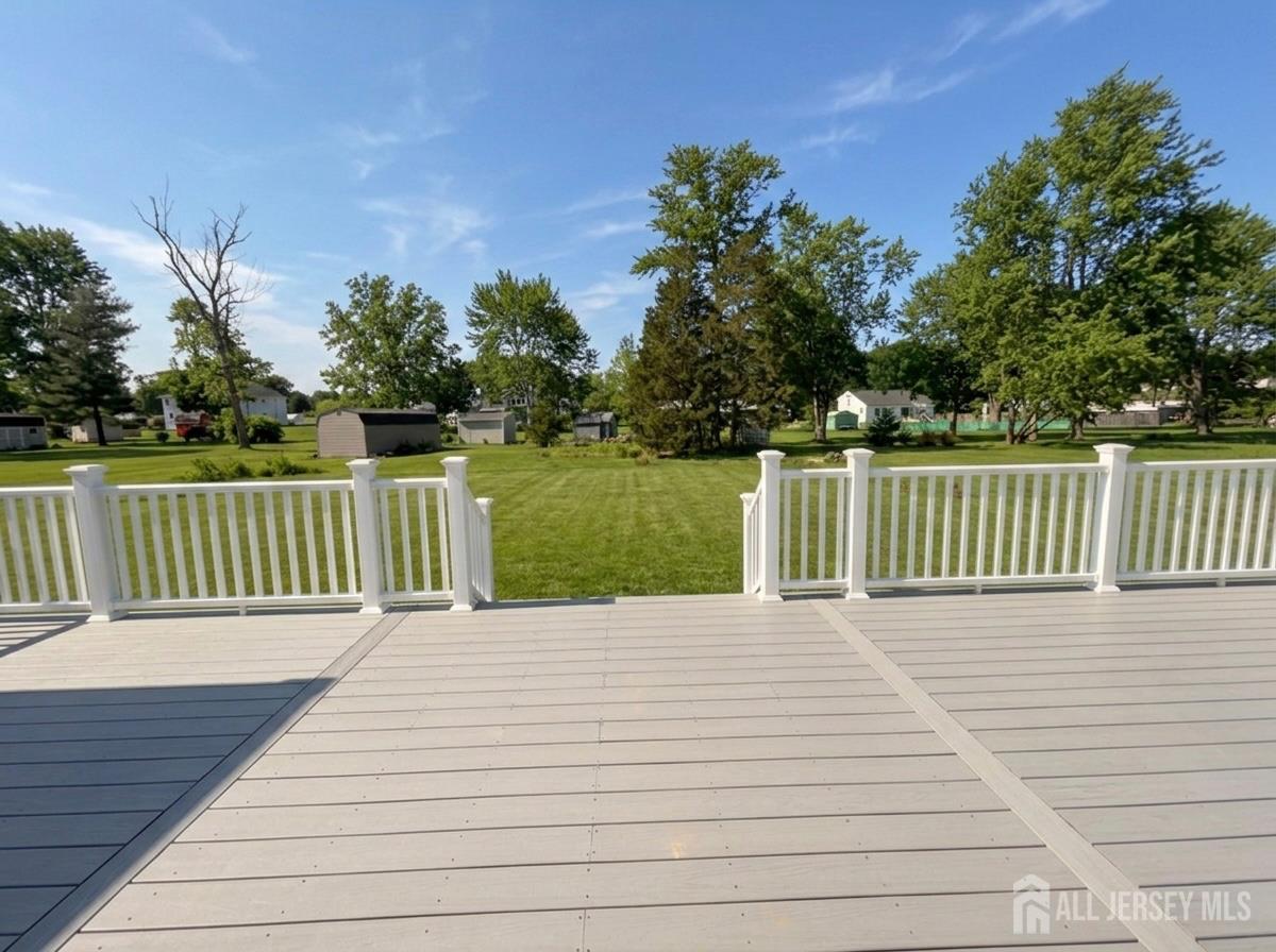 11 Williams Road Kendall Park, NJ 08824 - Photo 56 of 60 a view of a deck with trees in the background