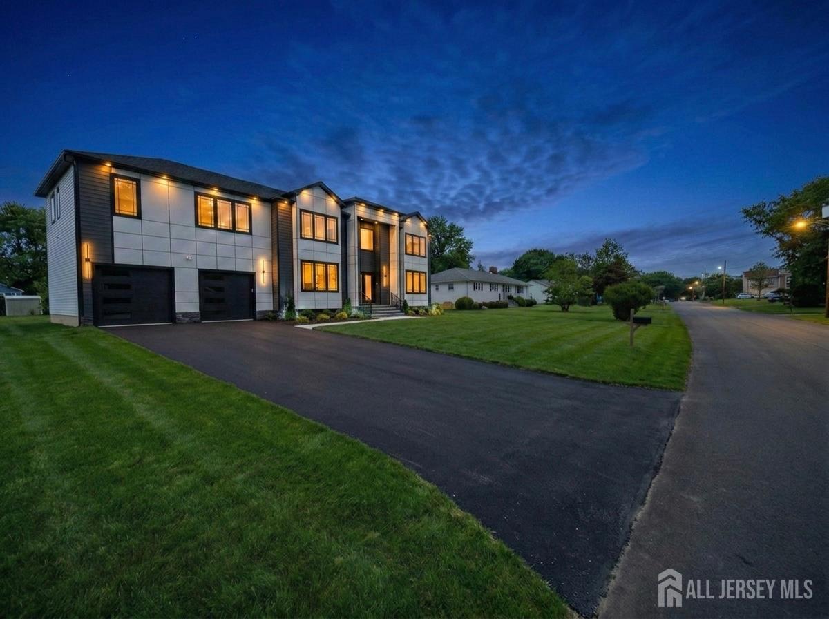 11 Williams Road Kendall Park, NJ 08824 - Photo 58 of 60 a front view of a building with a garden