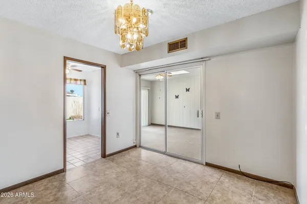 an empty room with a chandelier