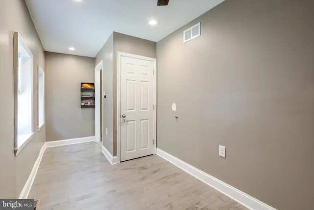 a view of a livingroom with furniture and a window