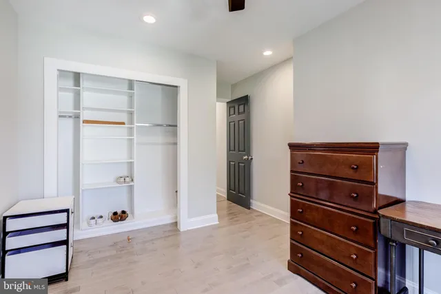 a view of entrance gate with wooden fence