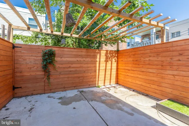 a view of a pathway along the house