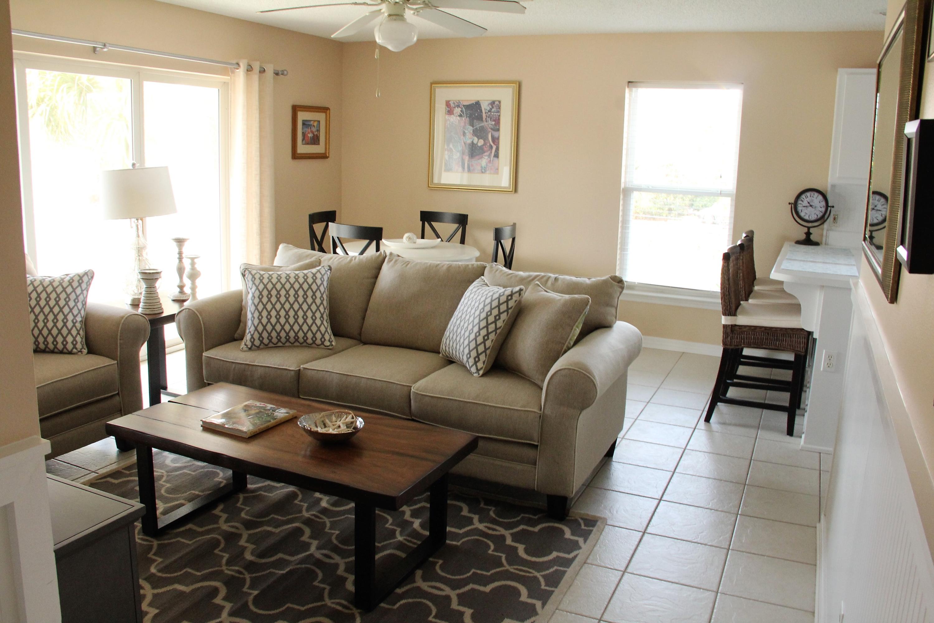 82 Sugar Sand Lane, Unit B4 Santa Rosa Beach, FL 32459 - Photo 2 of 33 a living room with furniture a table and a large window