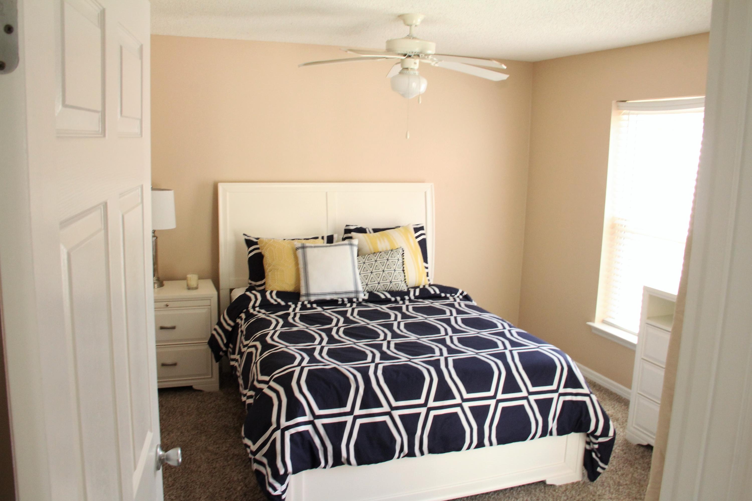 82 Sugar Sand Lane, Unit B4 Santa Rosa Beach, FL 32459 - Photo 12 of 33 a bed room with a bed and wooden floor