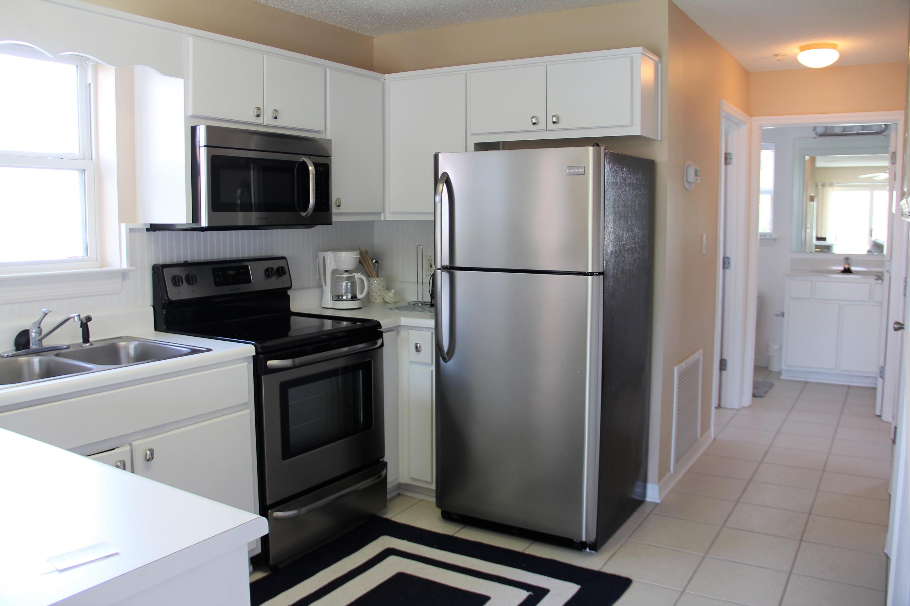 82 Sugar Sand Lane, Unit B4 Santa Rosa Beach, FL 32459 - Photo 17 of 33 a kitchen with a refrigerator sink and microwave