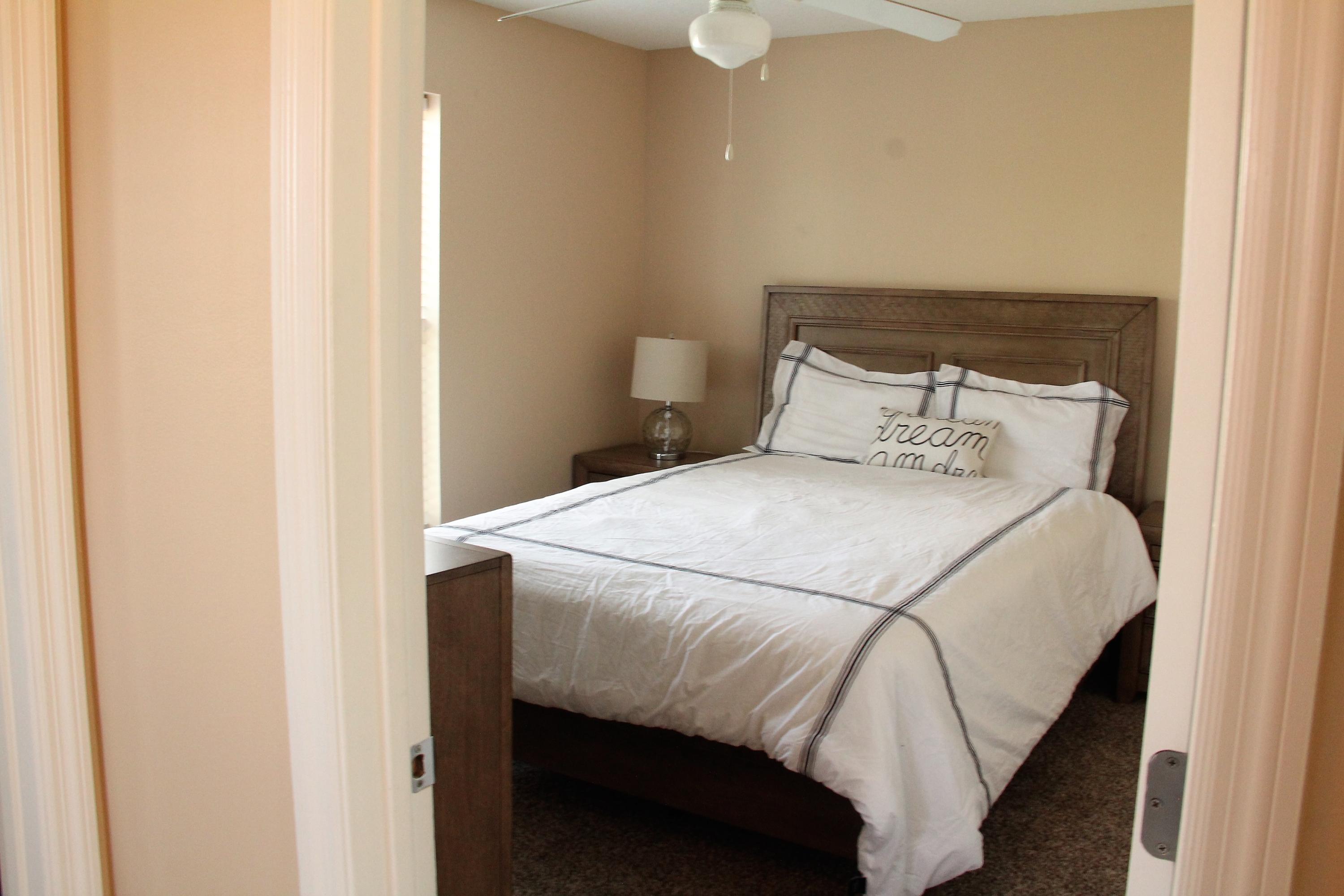 82 Sugar Sand Lane, Unit B4 Santa Rosa Beach, FL 32459 - Photo 21 of 33 a bed sitting in a bedroom next to a bathroom