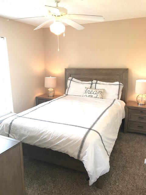 82 Sugar Sand Lane, Unit B4 Santa Rosa Beach, FL 32459 - Photo 22 of 33 a bedroom with a bed and a ceiling fan