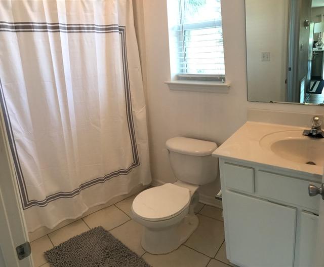 82 Sugar Sand Lane, Unit B4 Santa Rosa Beach, FL 32459 - Photo 25 of 33 a white toilet sitting next to a bathroom sink