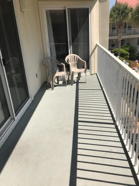 82 Sugar Sand Lane, Unit B4 Santa Rosa Beach, FL 32459 - Photo 26 of 33 a balcony with table and chairs