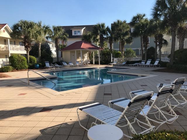 82 Sugar Sand Lane, Unit B4 Santa Rosa Beach, FL 32459 - Photo 30 of 33 a view of a patio with chairs and umbrellas on a patio