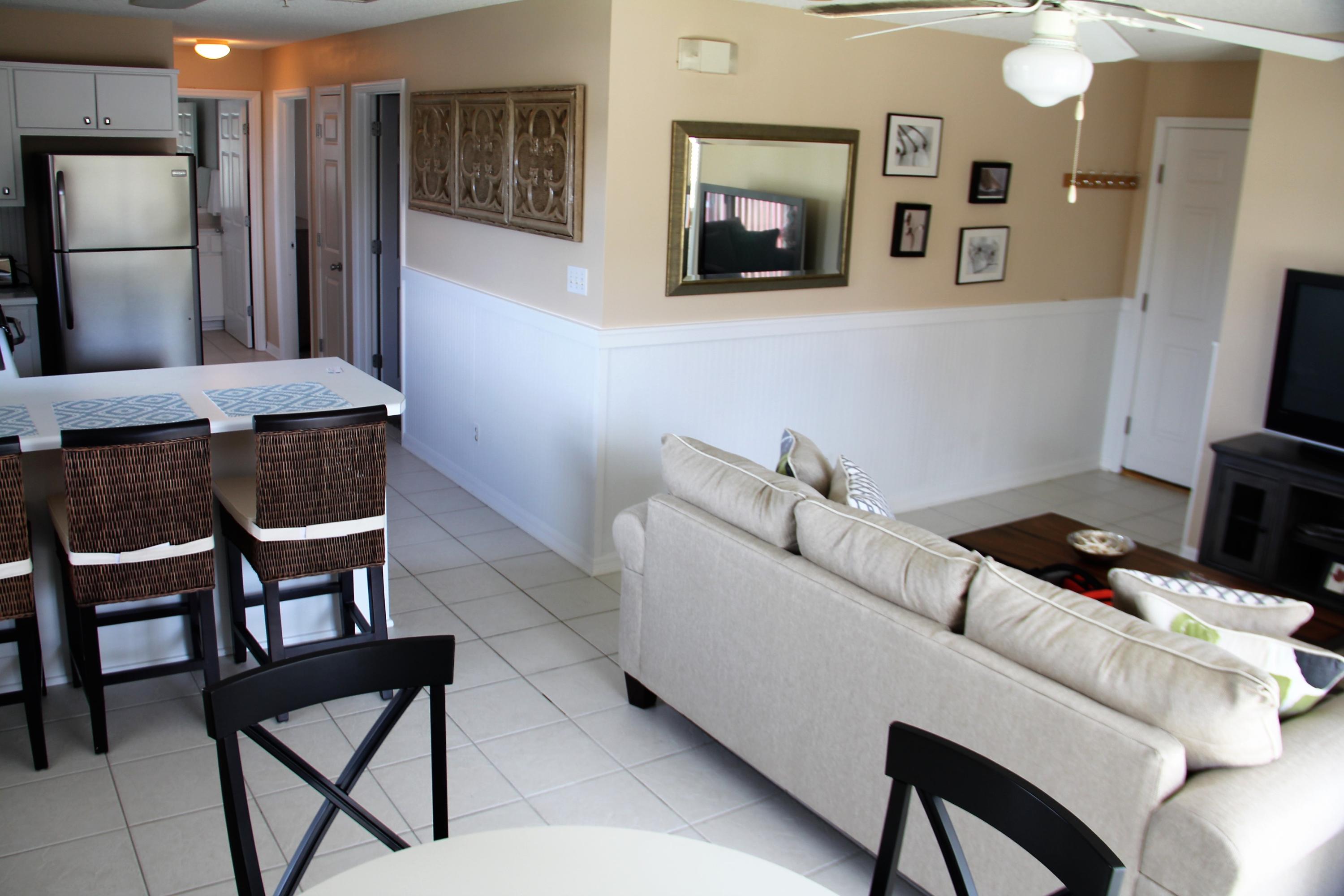 82 Sugar Sand Lane, Unit B4 Santa Rosa Beach, FL 32459 - Photo 10 of 33 a living room with furniture and a flat screen tv