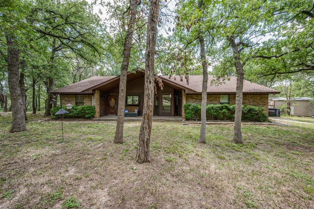 599 Wild Wood Drive Decatur, TX 76234 - Photo 1 of 1 a view of a house with a yard