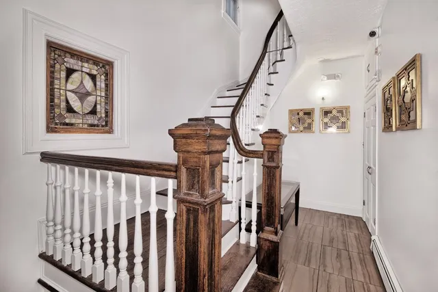 a view of entryway with wooden floor