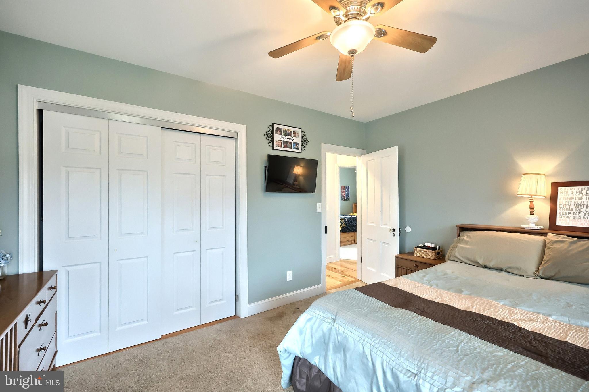 2856 Centennial Road Hanover, PA 17331 - Photo 24 of 34 a bedroom with a bed and a chandelier
