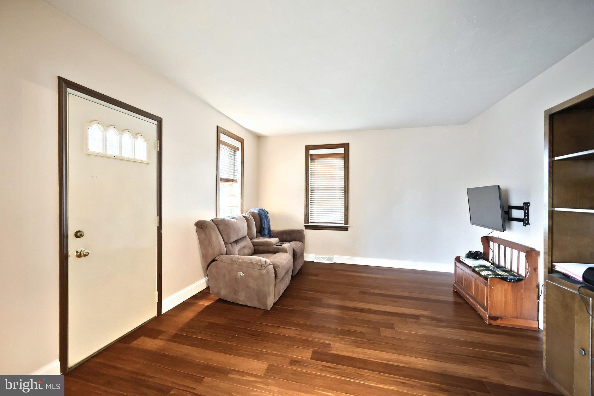 2856 Centennial Road Hanover, PA 17331 - Photo 5 of 34 a living room with furniture and a flat screen tv