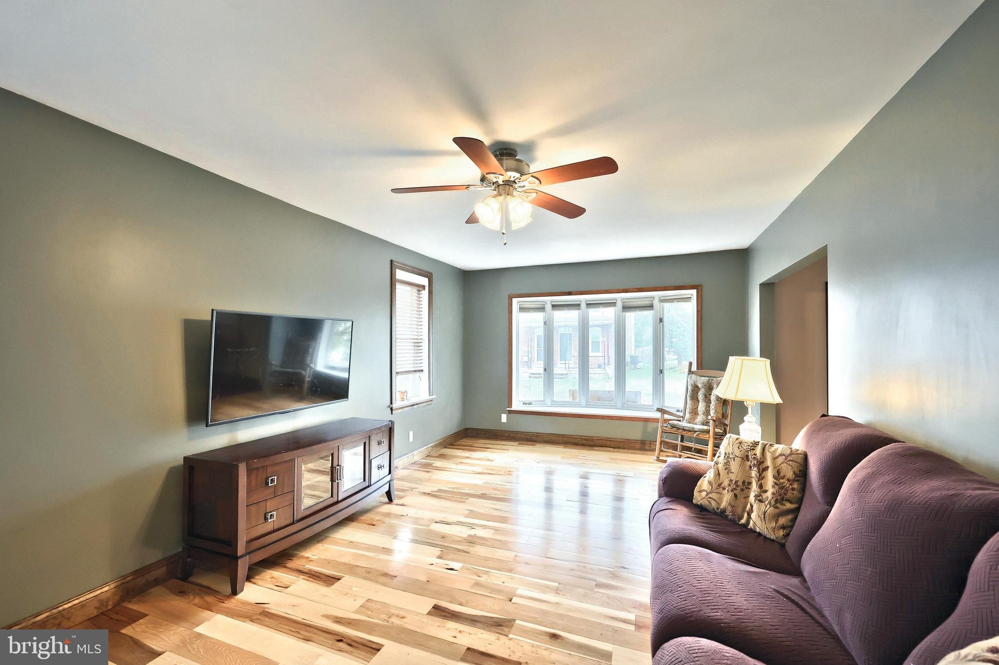 2856 Centennial Road Hanover, PA 17331 - Photo 8 of 34 a living room with furniture and a flat screen tv