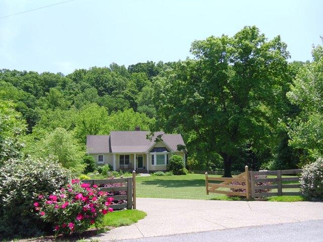 7465 South Harpeth Road Franklin, TN 37064 - Photo 1 of 30 a house view with a garden space
