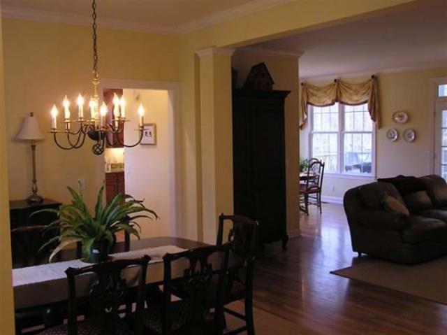 7465 South Harpeth Road Franklin, TN 37064 - Photo 2 of 30 a dining room with wooden floor a chandelier a glass table and chairs