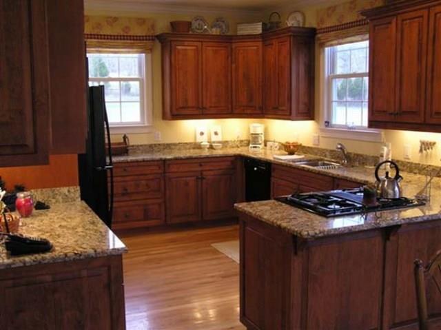 7465 South Harpeth Road Franklin, TN 37064 - Photo 4 of 30 a kitchen with granite countertop a sink stove and cabinets