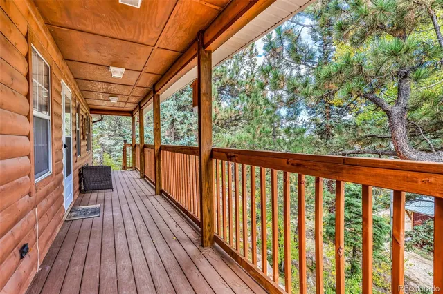 a view of a balcony with wooden floor