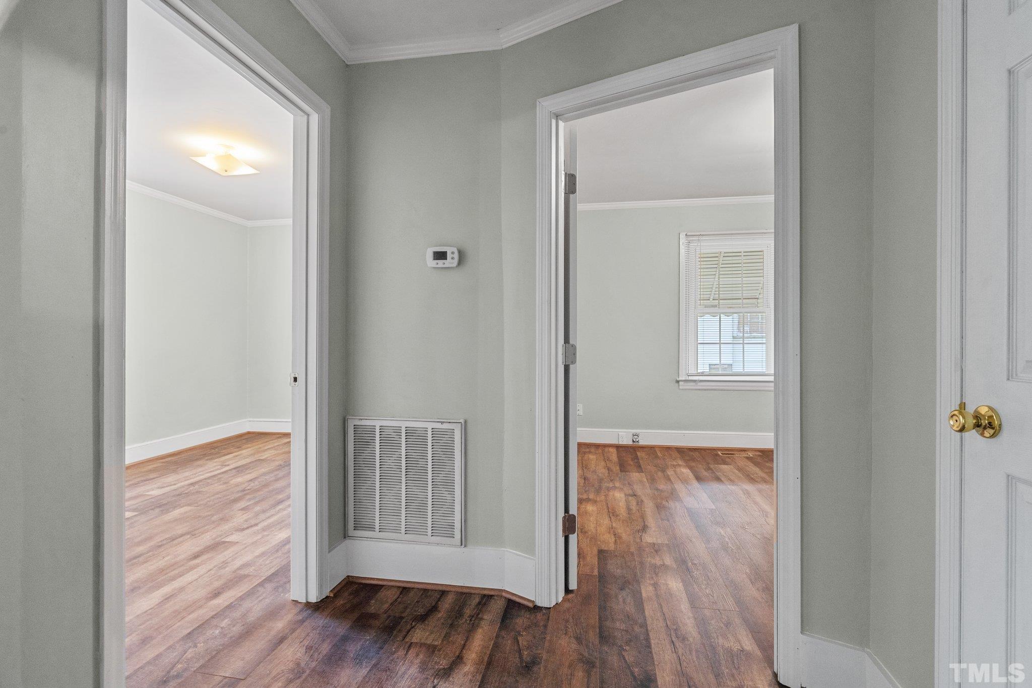 203 Spring Street Louisburg, NC 27549 - Photo 13 of 23 an empty room with wooden floor & closet area