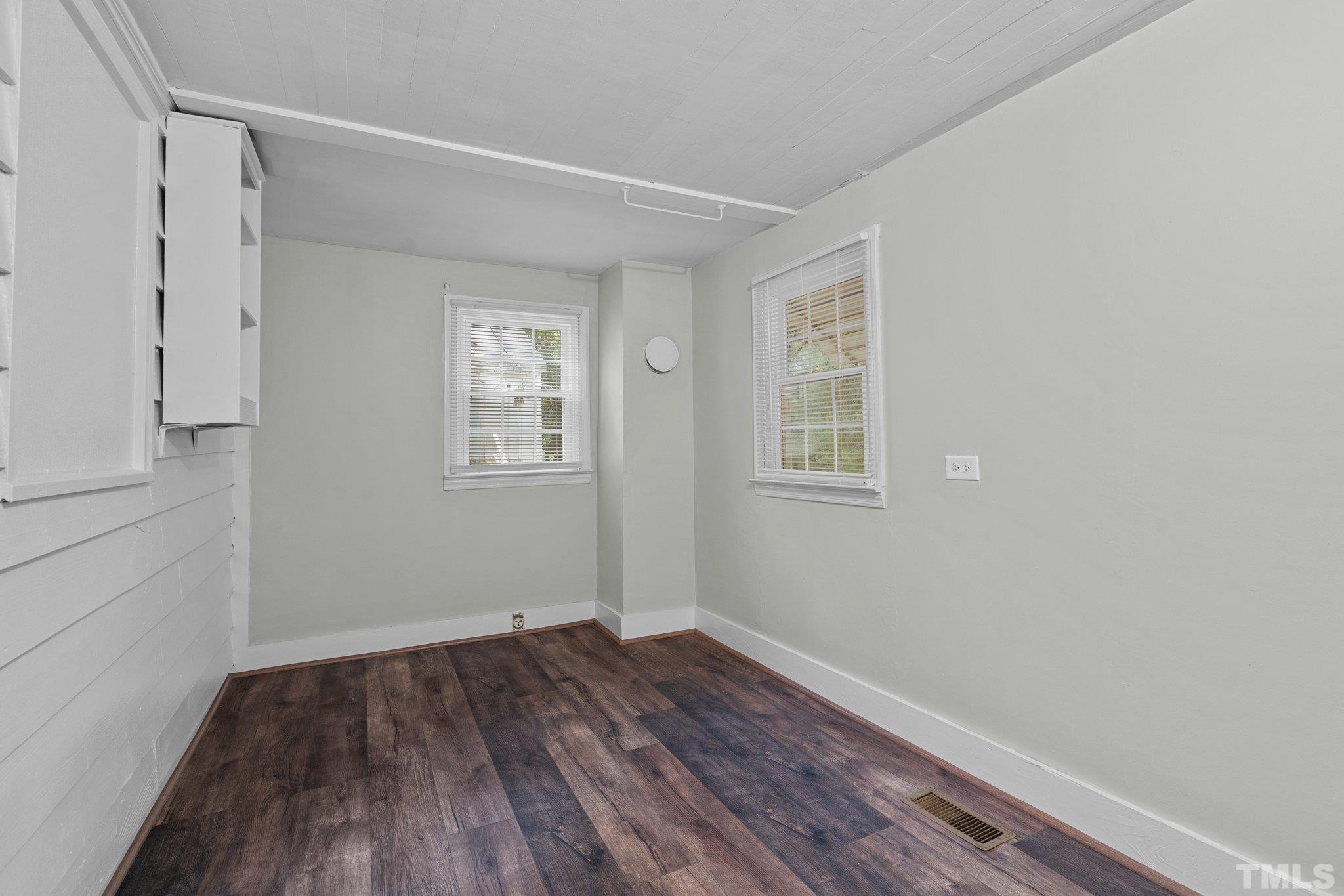 203 Spring Street Louisburg, NC 27549 - Photo 18 of 23 a view of a room with wooden floor and windows