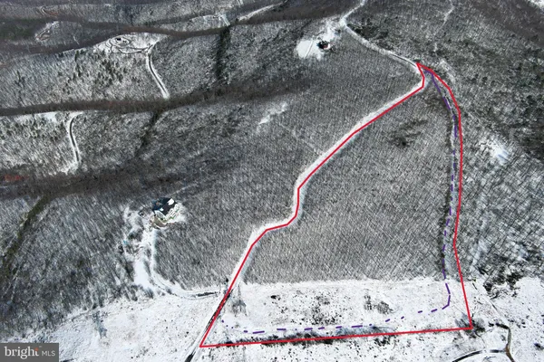 a sign that is on a brick wall