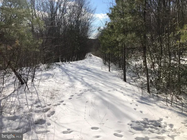a porch with a bench in front of it