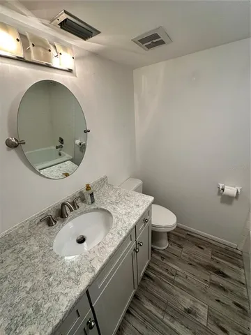 a bathroom with a sink and mirror