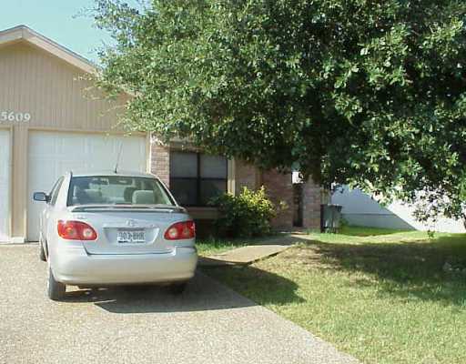 5609 Teri Road Austin, TX 78744 - Photo 1 of 1 a car parked in front of white house